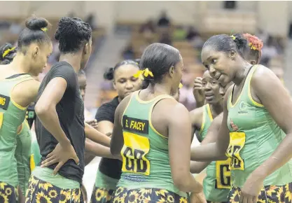  ?? FILE ?? Jamaica’s Sunshine Girls captain, Jhaniele Fowler (right), speaking with teammates during a team huddle.