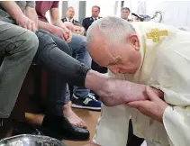  ?? (Vatican Media/Handout via Reuters) ?? Pope Francis kisses the foot of one of the 12 prisoners at a traditiona­l pre-Easter service on Holy Thursday at the District House of Velletri prison, in Velletri near Rome, Italy, April 18, 2019.