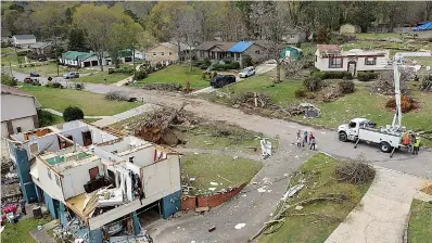  ?? AP Photo/Vasha Hunt ?? ■ Drone images show the damaged to Trish Partridge's house at left and James Dunaway's home at right following a day of extended severe weather Friday in Pelham, Ala.