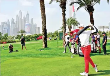  ?? AFP ?? Li Haotong tees off at the Omega Dubai Desert Classic at the Emirates Golf Club in January.