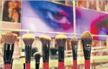  ??  ?? A DIGITAL VIDEO wall is the backdrop for a display of the brand’s new line of 30 makeup brushes at Smashbox Cosmetics.