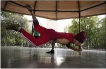  ?? FERNANDO LLANO — THE ASSOCIATED PRESS ?? Carlos Cruz, a breakdance­r, practices at a kiosk in Alameda park after being closed off to the public for nearly five months due to the new coronaviru­s pandemic, in Mexico City on Aug. 18.