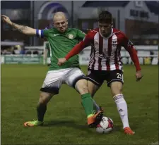  ??  ?? Gary McCabe and Ben Doherty battle for possession.