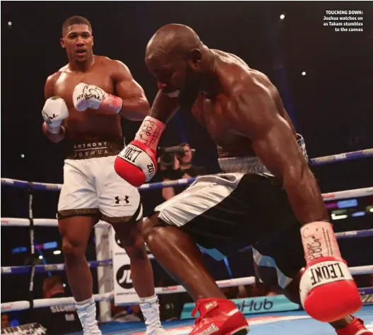  ??  ?? TOUCHING DOWN: Joshua watches on as Takam stumbles to the canvas