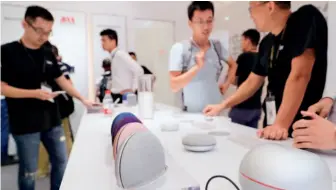  ??  ?? September 5, 2018: Intelligen­t sound boxes on display at the Shanghai Internatio­nal Smart Home Exhibition 2018 attract many spectators. by Fang Zhe/ Xinhua