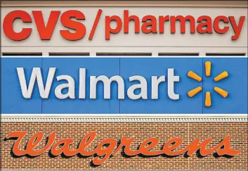  ?? The Associated Press ?? A federal court hearing will result in a judge determinin­g how much Cvshealth, Walgreens Co. and Walmart Corp. should pay two Ohio counties over the opioid crisis.