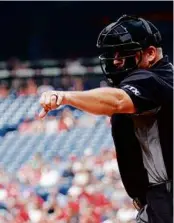  ?? TIM NWACHUKWU/GETTY IMAGES ?? New research shows umpires are more likely to call a strike after one or more bad calls against the pitcher.