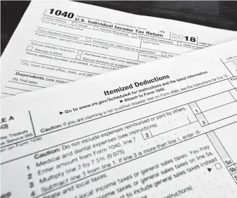 ?? Associated Press file photo ?? Four states sued the federal government over the 2017 tax reform law’s limit of $10,000 on the amount of state and local tax payments that can be written off if deductions are itemized.