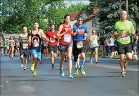  ?? FILE PHOTO - ONEIDA DISPATCH ?? Racers pass the 9mile marker at the Boilermake­r 2016in Utica on Sunday, July 10.