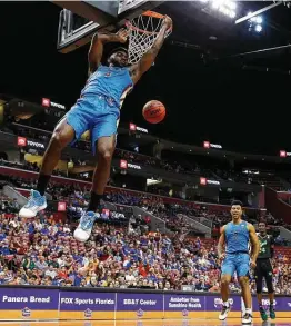  ?? Michael Reaves / Getty Images ?? Patrick Williams, dunking against South Florida in December, was honored with the Atlantic Coast Conference’s Sixth Man of the Year Award as a freshman.