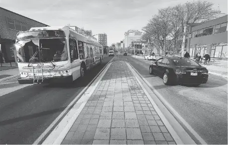  ?? DAN JANISSE ?? A refurbishe­d section of Ouellette Avenue between Wyandotte and Elliott streets has reopened to traffic in both directions after months of constructi­on.