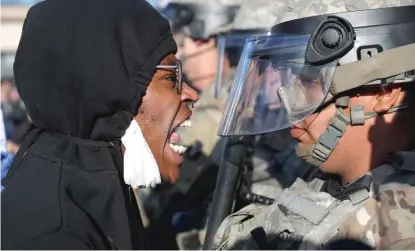  ?? JOHN MINCHILLO/AP ?? A protester yells at a member of the Minnesota National Guard during a protest Friday in Minneapoli­s.