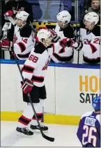  ?? — THE ASSOCIATED PRESS ?? Jaromir Jagr is congratula­ted by Devils teammates after he scored his 700th NHL goal Saturday.