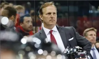  ?? SALVATORRE DI NOLFI, THE CANADIAN PRESS ?? Jon Cooper, head coach of the Canadian hockey team, watches the play Tuesday during a friendly against Switzerlan­d in Geneva. The IIHF world championsh­ip opens Friday in Paris and Cologne.