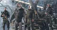  ??  ?? Woody Harrelson, centre, in a scene from War For The Planet Of The Apes.