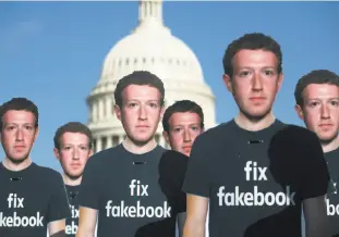  ?? Saul Loeb / AFP / Getty Images ?? One hundred cutouts of Facebook founder and CEO Mark Zuckerberg stand outside the Capitol in Washington, D.C. Zuckerberg said he was “happy” to testify before Congress.