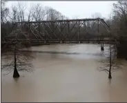  ?? (Arkansas Democrat-Gazette/Thomas Metthe) ?? The old iron bridge crossing the Maumelle River, built in 1920, is one of five properties added to the National Register of Historic Places. The bridge, in Pulaski County, southwest of Natural Steps where Old Highway 300 crosses over is now a walking bridge along the Ouachita Trail.