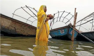  ?? REUTERS ?? A Hindu woman worships in the waters of the Yamuna River in Allahabad. The river, the sole source of water for more than 60 million Indians, has in the past decades become one of the dirtiest on Earth.