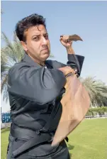  ?? Times Khaleej ?? YEE HA! A demo of his Arnis moves at the office in Dubai. Photo: Leslie Pableo