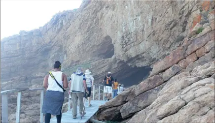  ?? PICTURES: NICKY WILLEMSE ?? It’s a long walk down, and then up, to Pinnacle Point’s cave PP13B, where evidence of Middle Stone Age people dates back 160 000 to 90 000 years.