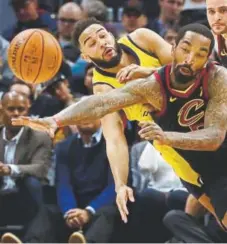  ?? Gregory Shamus, Getty Images ?? J.R. Smith. right, of Cleveland and Cory Joseph of Indiana battle for the ball Sunday.