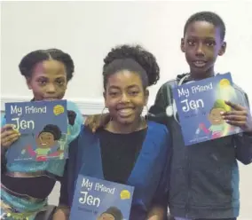  ?? (Photos: JAX PHOTOGRAPH­Y) ?? My Friend Jen author, sickle cell patient and philanthro­pist Jenica Leah pauses for a quick picture with two children at her book launch.