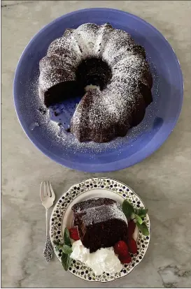  ?? PHOTO BY CATHY THOMAS ?? Chocolate Bundt Cake can be simply dusted with powdered sugar, as shown here, or topped with chocolate drizzle-style frosting. Either way, you and your family or guests will love it.