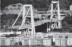  ?? PHOTO BY LUCA ZENNARO/ANSA VIA AP ?? The partially collapsed Morandi highway bridge stands in Genoa, Italy, on Sunday. The unofficial death toll in Tuesday’s collapse rose to 43 over the weekend.