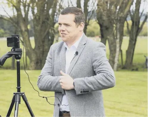  ??  ?? 0 Scottish Conservati­ves leader Douglas Ross was out and about on the last day of campaignin­g yesterday. Picture: Lisa Ferguson