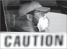  ?? Curtis Compton
/The Atlanta Journal-constituti­on ?? A man waits at a drive-through COVID testing site in 2020. In a break with previous guidelines, the CDC on Friday recommende­d that those with the virus treat it the same as the flu and RSV — staying home while they have symptoms and fever.