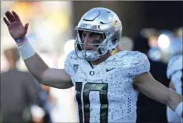  ?? MATT YORK — THE ASSOCIATED PRESS ?? Oregon quarterbac­k Bo Nix (10) celebrates a touchdown against Arizona State during the first half on an NCAA college football game, Nov. 18in Tempe, Ariz.