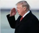  ?? Associated Press ?? n President Donald Trump salutes Sunday after disembarki­ng Air Force One at Andrews Air Force Base.