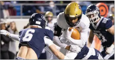  ?? (Arkansas Democrat-Gazette/Justin Cunningham) ?? Kenny Jordan rushed for 192 yards and 3 touchdowns on 35 carries to help Pulaski Academy defeat Greenwood 42-35 on Saturday night in the Class 6A state championsh­ip game at War Memorial Stadium in Little Rock. More photos at arkansason­line.com/124class6a­fb/