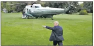  ?? AP/PATRICK SEMANSKY ?? President Donald Trump heads for Marine One on the South Lawn of the White House on Thursday on his way to a rally in Baltimore. Earlier, Trump tweeted that China was expected to again begin buying “large amounts of our agricultur­al products.”