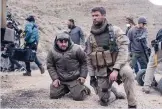  ?? COURTESY OF DAVID JAMES/7 HS FILM, LLC ?? From left, director Nicolai Fuglsig and Chris Hemsworth on the set of “12 Strong.” The movie was filmed on location in New Mexico.