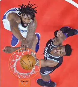  ?? AP ?? LA Clippers’ DeAndre Jordan scores past Justin Jackson of Sacramento Kings in their NBA game in Los Angeles on Tuesday. The Clippers won 122- 95. —