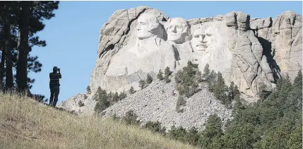  ?? — GETTY IMAGES FILES ?? The Mount Rushmore National Memorial in South Dakota features the likenesses of four presidents — George Washington, Thomas Jefferson, Teddy Roosevelt and Abraham Lincoln.