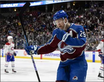  ?? PHOTOS BY ANDY CROSS — THE DENVER POST ?? Avalanche center Nathan Mackinnon celebrates moments after he scored a goal against the Montreal Canadiens in the first period at Ball Arena on Tuesday.