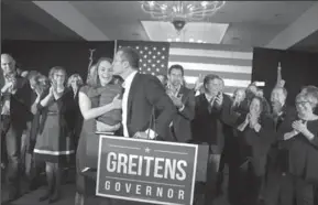  ?? CHRISTIAN GOODEN/ST. LOUIS POST-DISPATCH ?? Eric Greitens kisses his wife, Sheena, before giving his victory speech after winning the Missouri governor’s race on Nov. 8, 2016. Greitens has made curbing lobbyist gifts a key issue in his administra­tion, but a bill to ban lobbyists from giving...