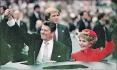  ?? Associated Press file photo ?? President Ronald Reagan and his wife, Nancy, during his first inaugural parade in 1981. The 40th president cast a long shadow on the Republican Party’s platform.