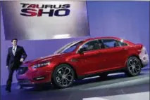  ?? THE ASSOCIATED PRESS ?? This April 20, 2011, file photo shows Mark Fields, executive vice president, Ford Motor Company, introducin­g the 2013 Ford Taurus SHO at the New York Internatio­nal Auto Show.