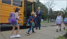  ?? PHOTOS BY LAUREN HALLIGAN ?? Caroline Street Elementary School principal Dr. Daniel Packard greets students with a smile on the first day of the 2021-2022school year.