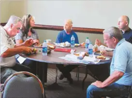  ?? Agnes Hagin/SJ ?? GICH team members participat­ed in a group meeting Thursday, Sept. 8 to discuss plans for a retreat in Gainesvill­e later this month. They are Jeff Ellis, Janet Tinney, David Cummings, Andy Morgan and Bruce Day.