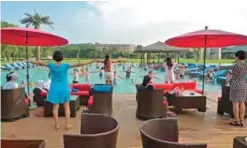  ??  ?? An instructor leads guests in a fitness class at the Club Med resort.