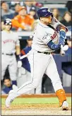  ?? (AP) ?? Houston Astros’ Yuli Gurriel hits a sacrifice fly scoring Michael Brantley during the seventh inning in Game 3 of baseball’s American League Championsh­ip Series against the New York Yankees on Oct 15 in New York.
