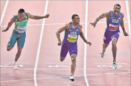  ?? AP ?? ■ Christian Coleman of the US crosses the line first in the 100 metres final, with compatriot Justin Gatlin second, in the World Athletics Championsh­ips in Doha on Saturday.