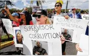  ?? JOE SKIPPER / ASSOCIATED PRESS ?? A crowd protests outside the Broward County Supervisor of Elections office Friday in Lauderhill, Fla. A possible recount looms in tight Florida races.
