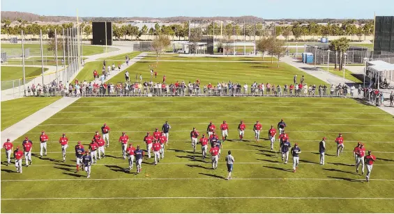  ?? STAFF PHOTO BY MATT STONE ?? ALL TOGETHER: The Red Sox hold their first official full-squad spring workout yesterday in Fort Myers.