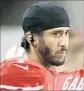  ?? Tony Avelar Associated Press ?? COLIN KAEPERNICK generated response by sitting during anthem.