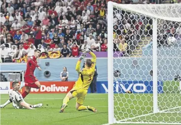  ?? ?? ↑ Spain striker Alvaro Morata, second from left, fires past Germany goalkeeper Manuel Neuer, under pressurefr­omdefender­niklassüle,toputhissi­deahead Picture:glynkirk/afpviagett­yimages